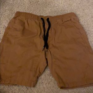 Khaki brown colored athletic shorts